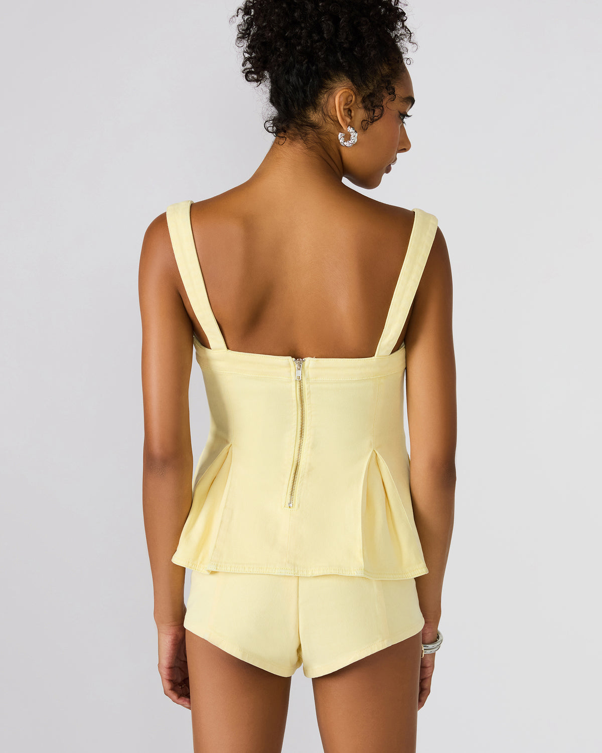 ZENIA Golden Glow Sleeveless Peplum Women's Top - Steve Madden